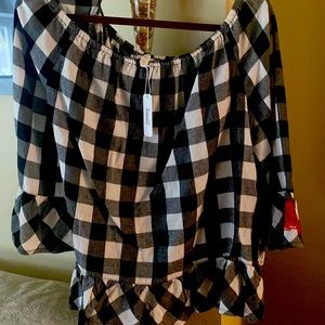 Woman’s black and white checkered top